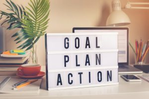 Goal,plan,action text on light box on desk table in home office.Business motivation or inspiration,performance of human concepts ideas